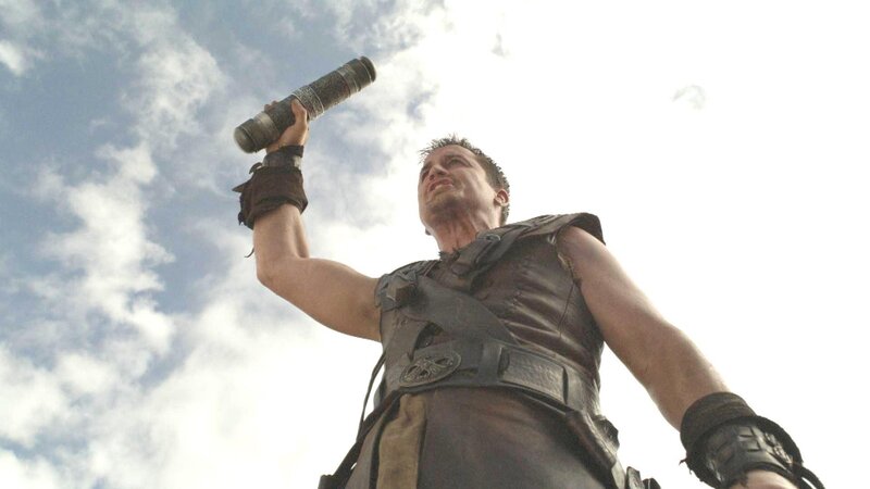 man holding weapon in sky