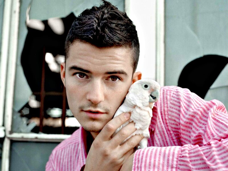 Man Holding White Parrot