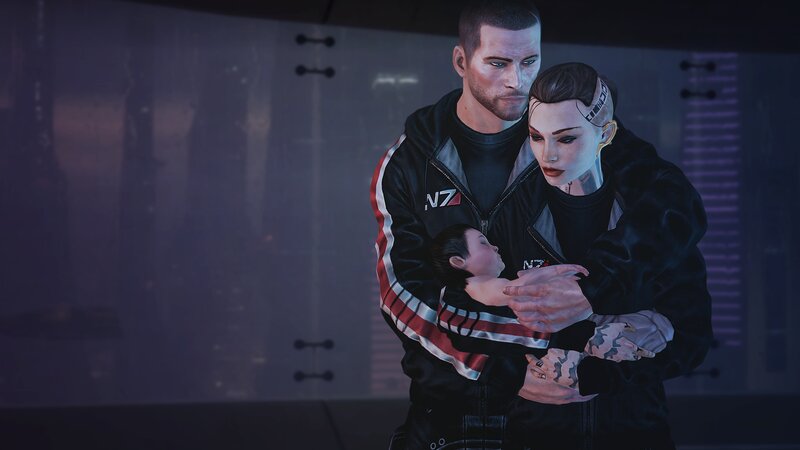 Man Holding Woman and Child