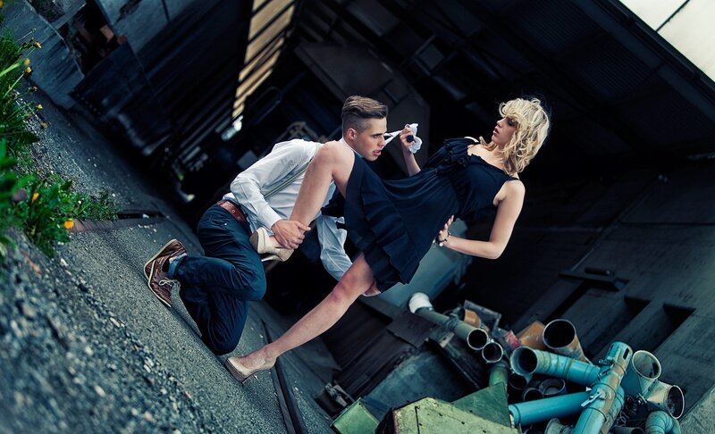 Man holding woman in dramatic pose
