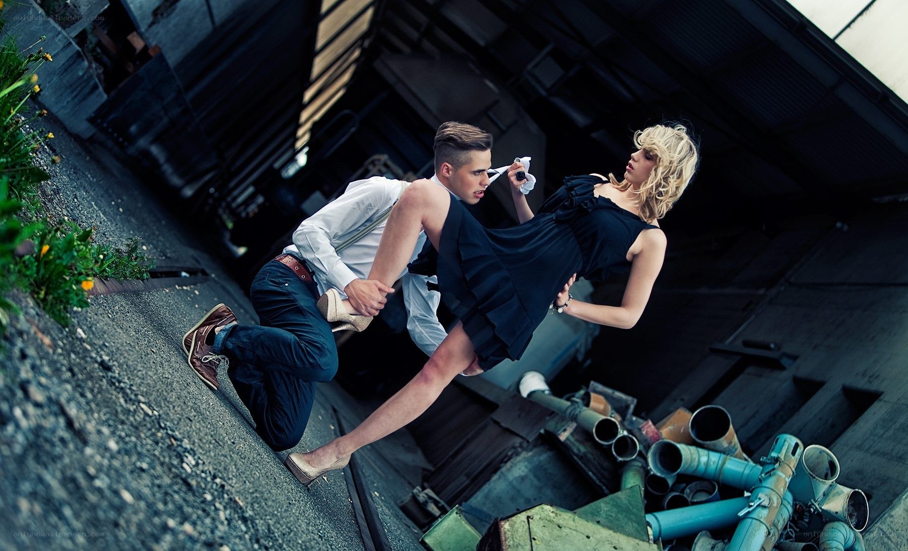 Man holding woman in dramatic pose