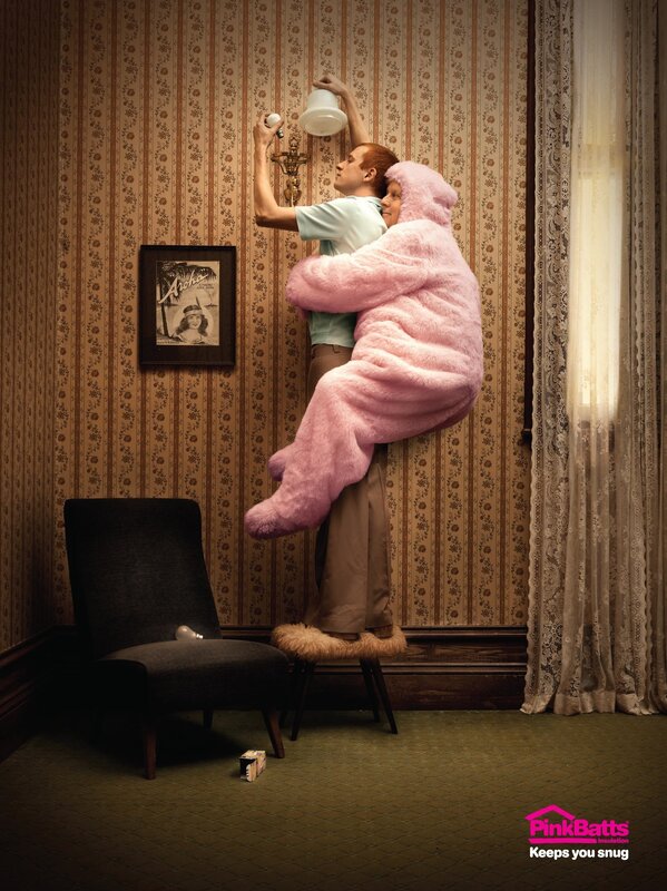 man holding woman in pink suit