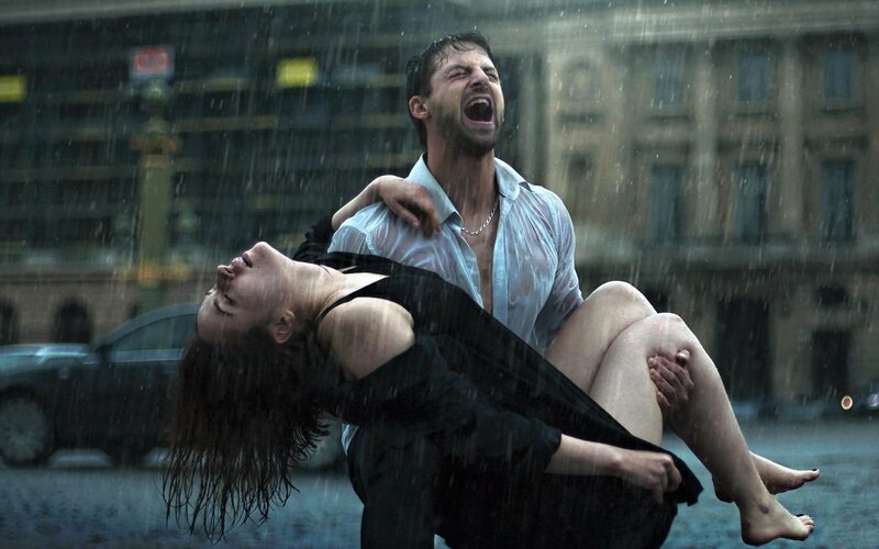 Man Holding Woman in Rain — Gray