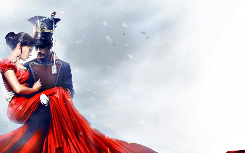 Man Holding Woman in Red Dress — Dramatic