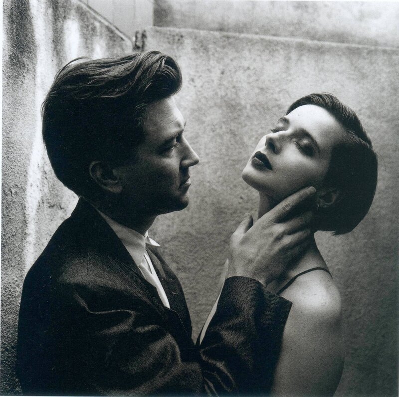 man holding woman's face
