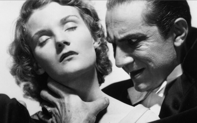 Man holding woman's neck