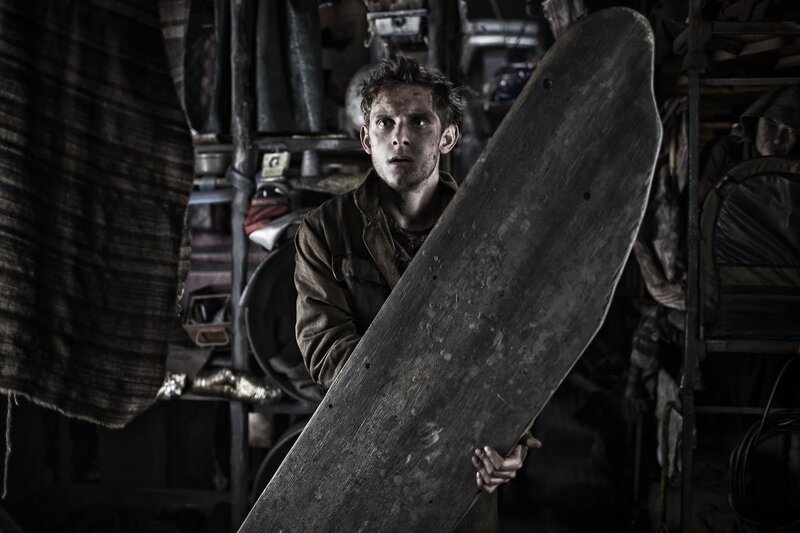man holding wooden board