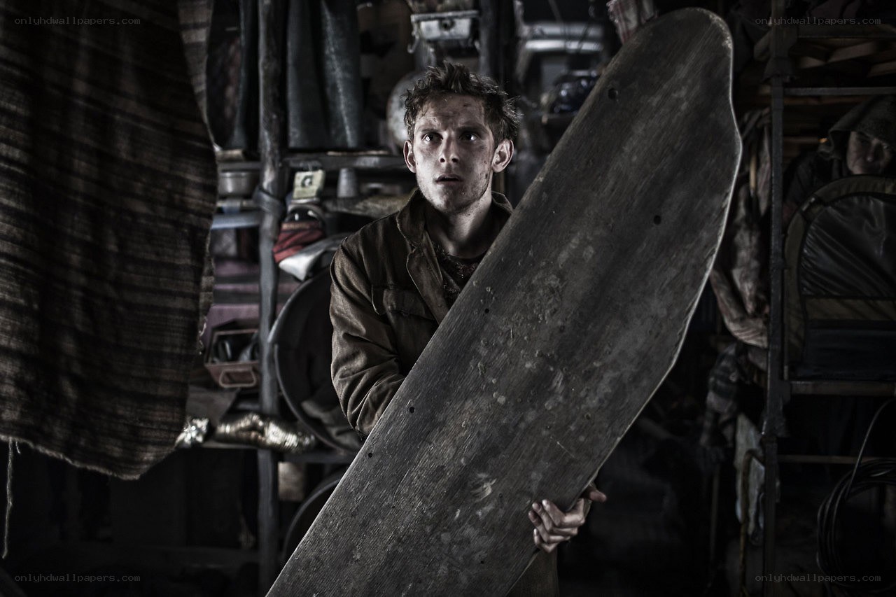 man holding wooden board