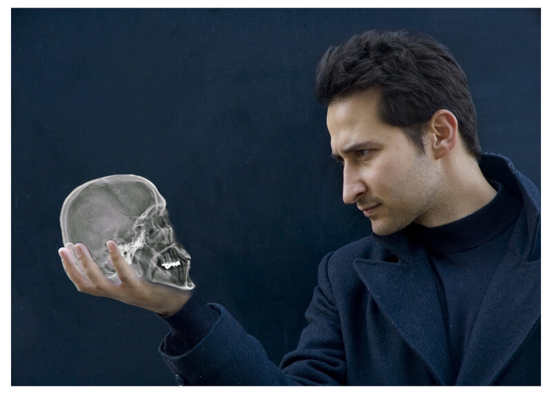 man holding x-ray skull