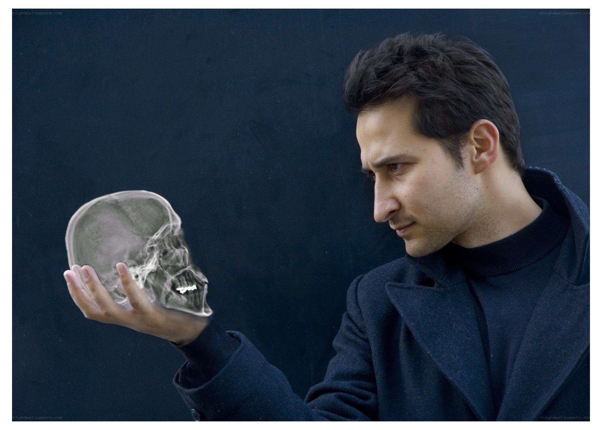 man holding x-ray skull