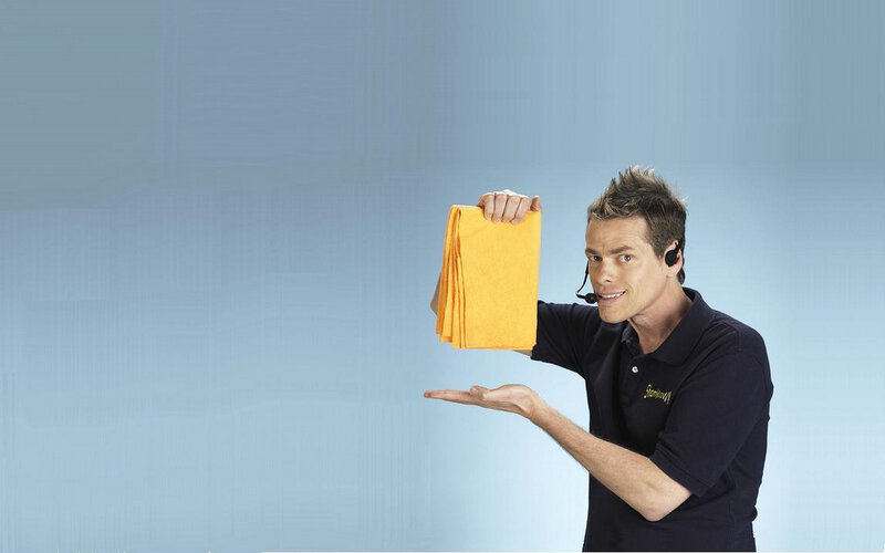 man holding yellow cloths