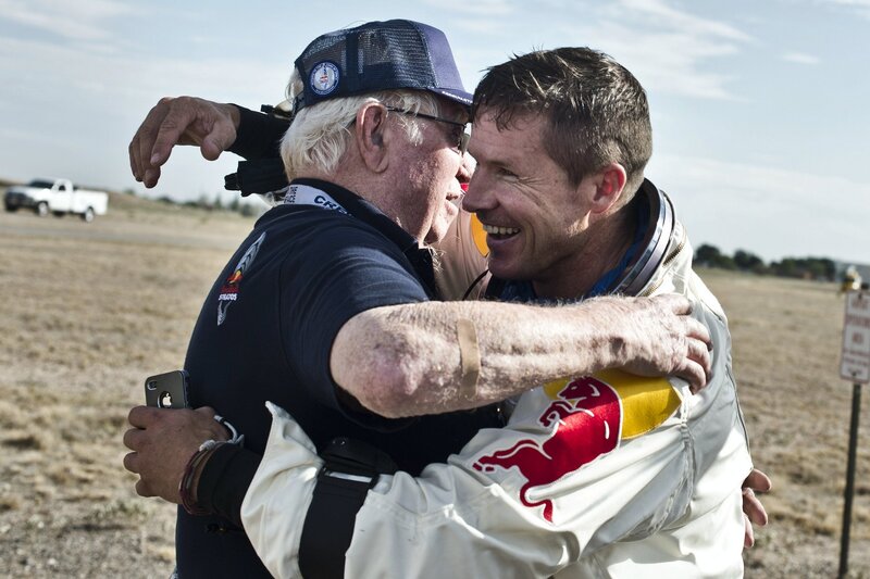 man hugging another man