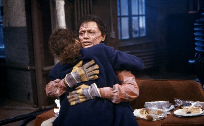 Man Hugging Child
