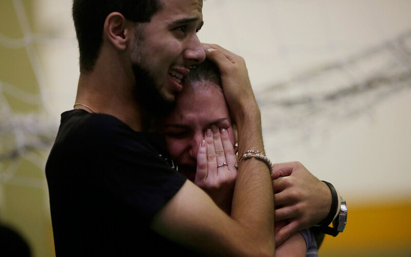 Man Hugging Crying Woman