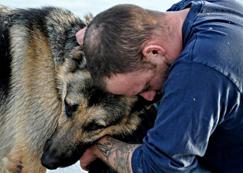 Man Hugging German Shepherd