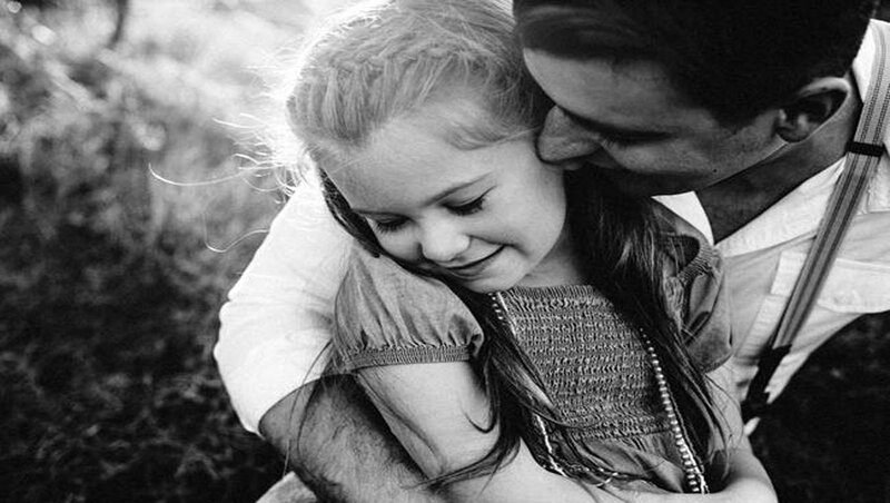 Man Hugging Girl