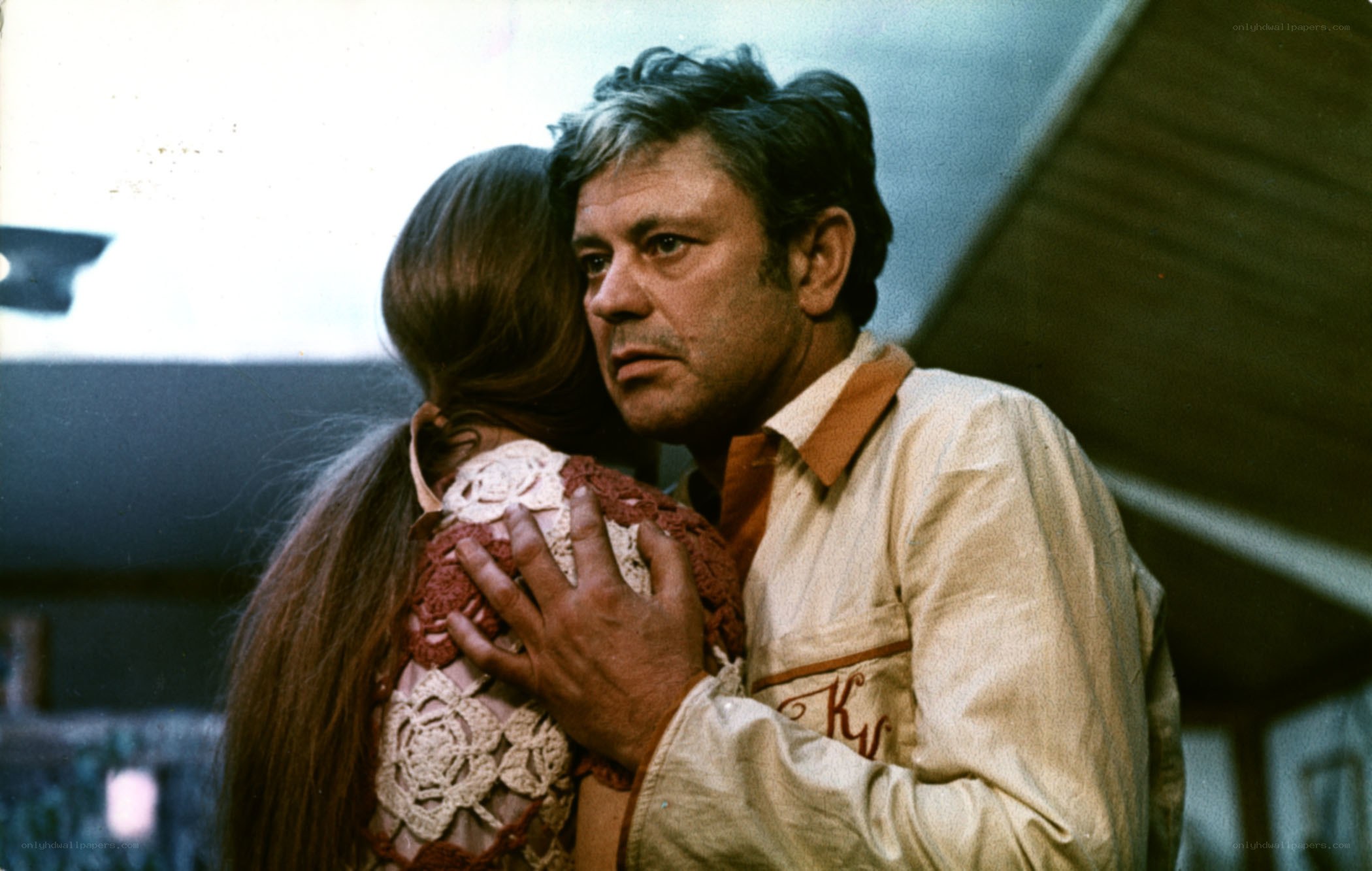 man hugging woman