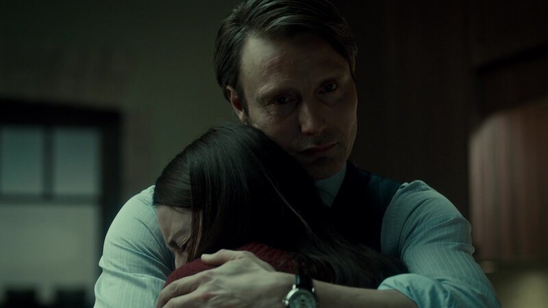 man hugging woman in dark room