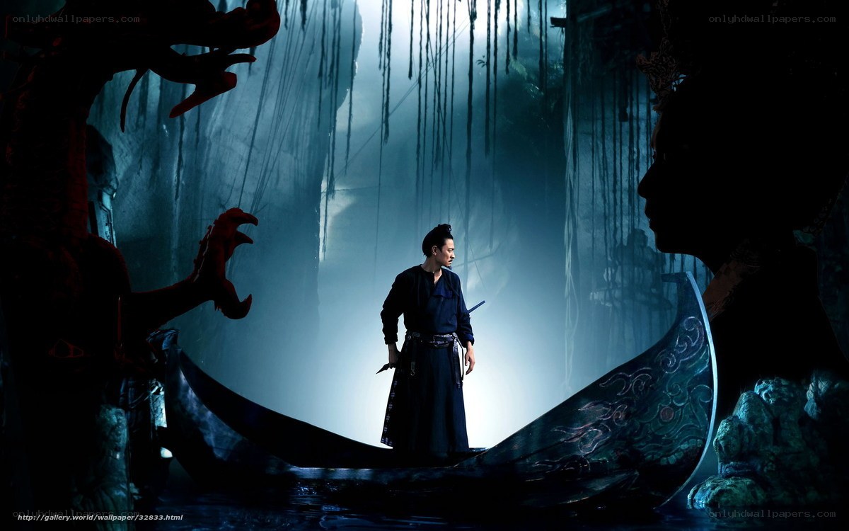 Man in a boat in a cave
