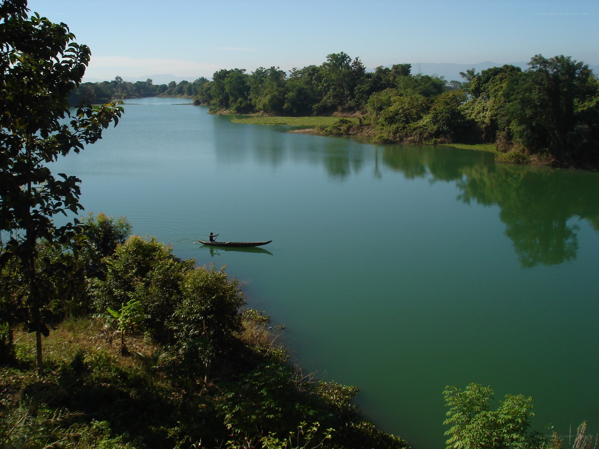 Man in a boat on a river