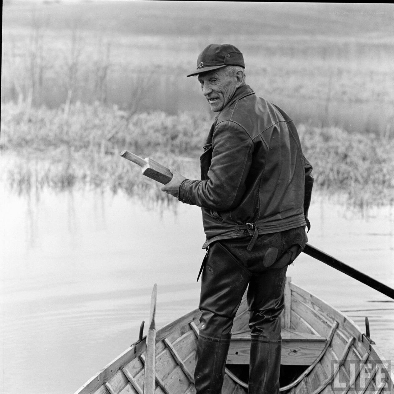 Man in a boat with oar