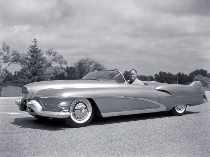 Man in a classic convertible car