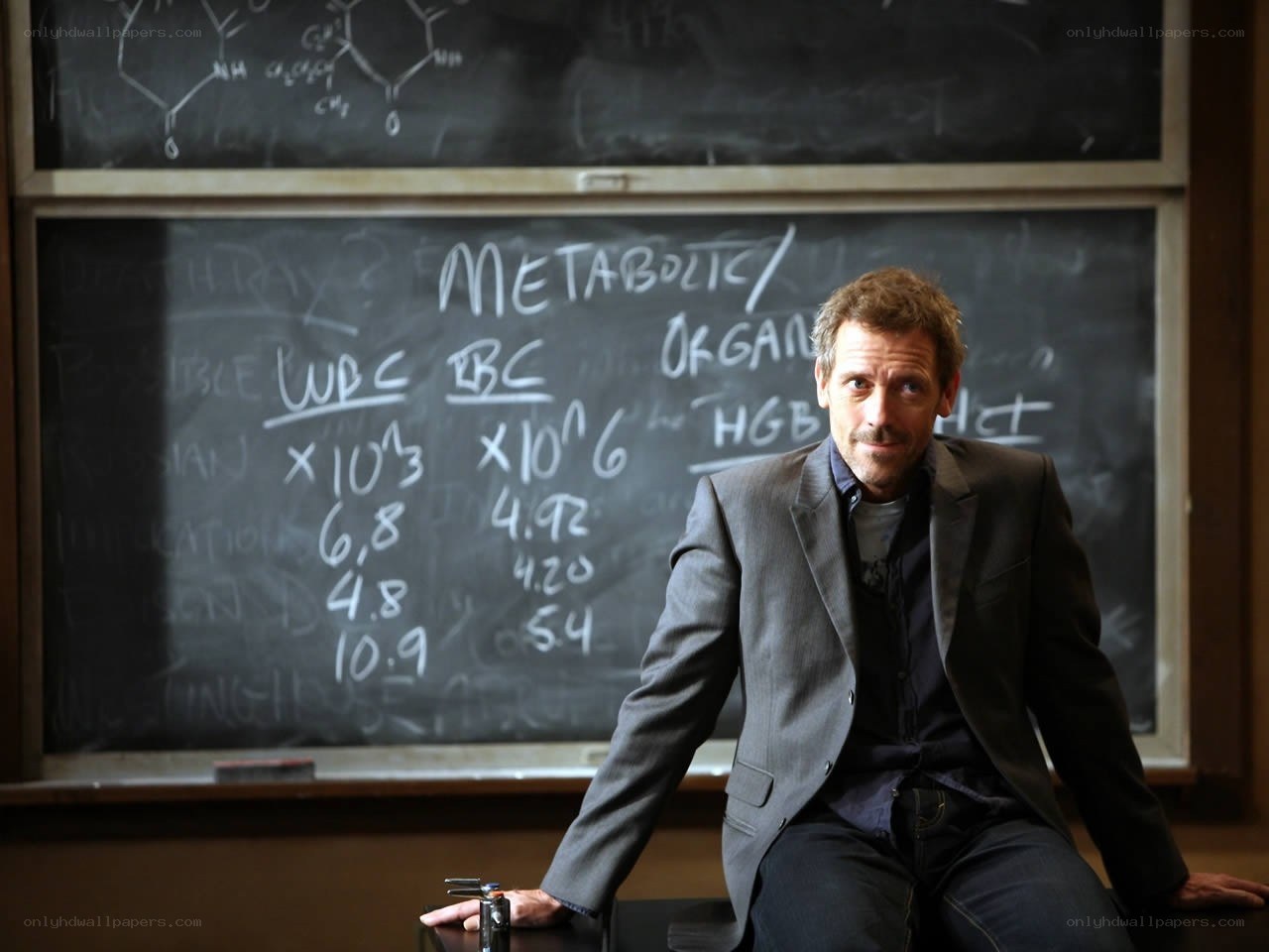 Man in a classroom with chalkboard