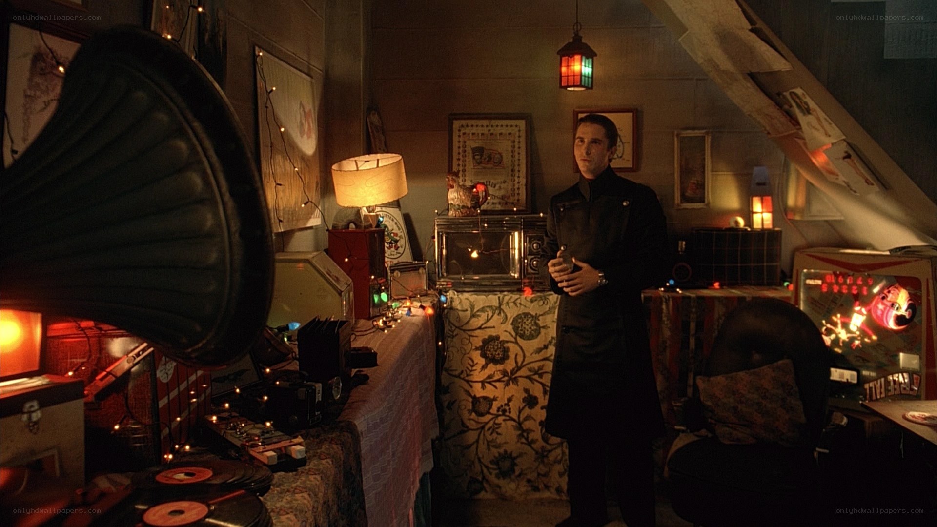 man in a cluttered attic room