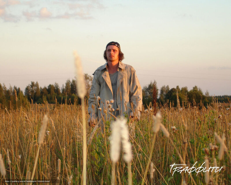 Man in a field at sunset
