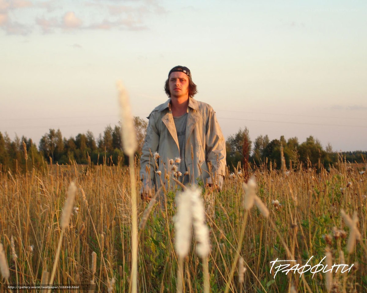 Man in a field at sunset