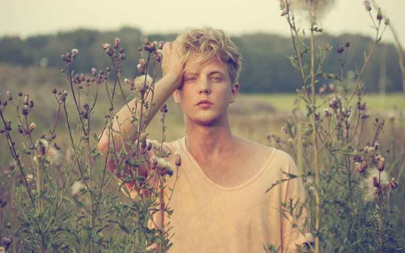 man in a field of wildflowers