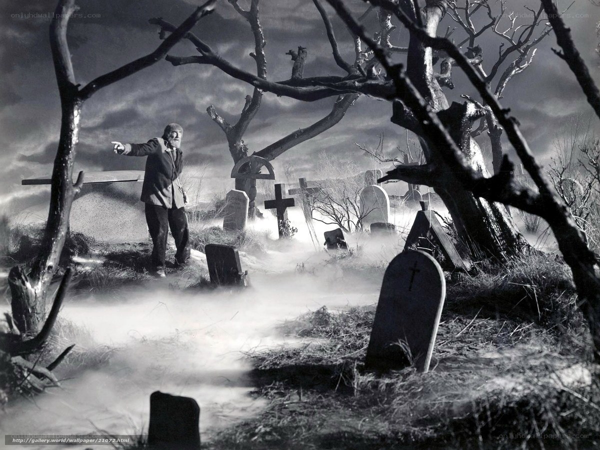 Man in a foggy graveyard