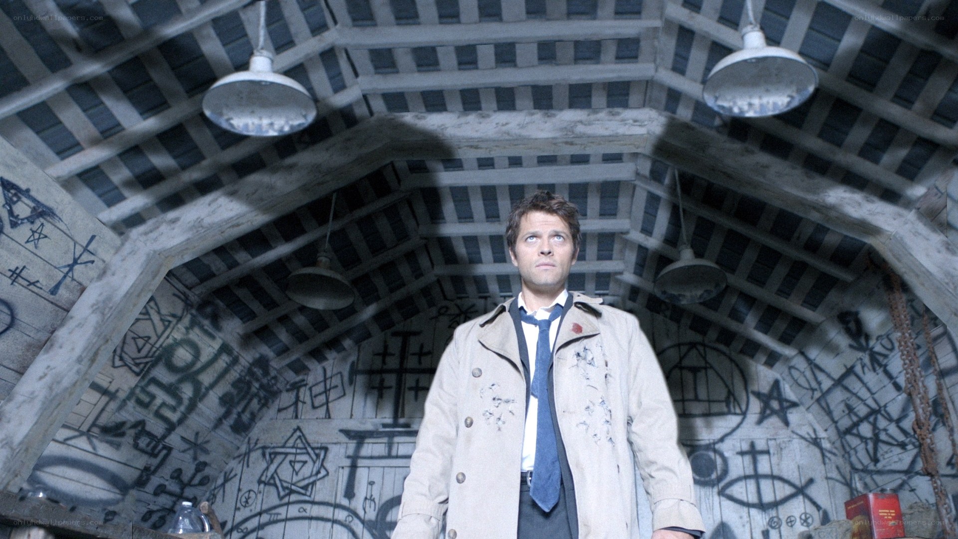 man in a graffiti-covered room
