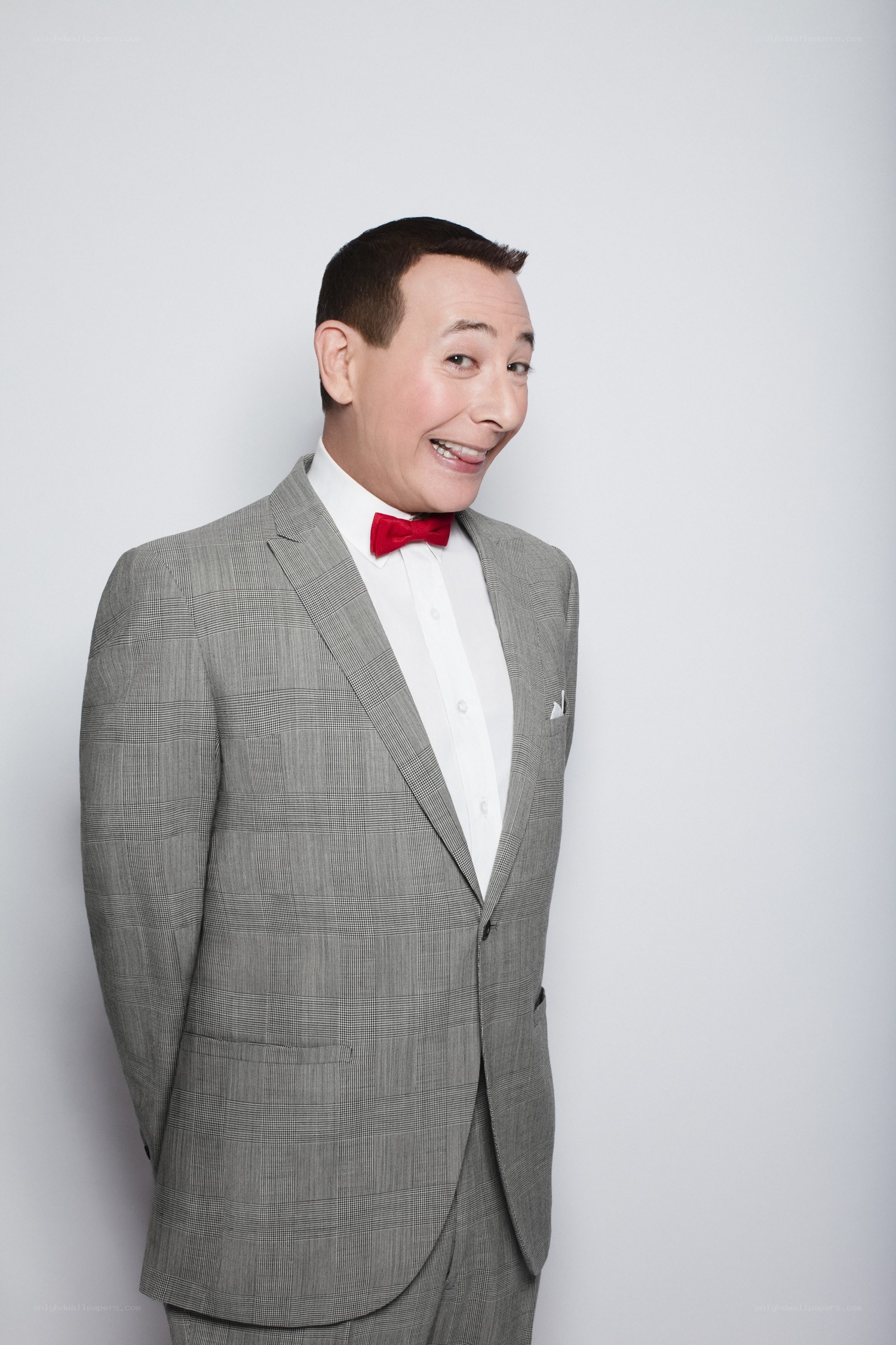 Man in a gray suit smiling