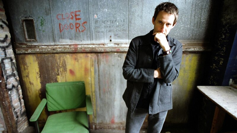 man in a grungy room