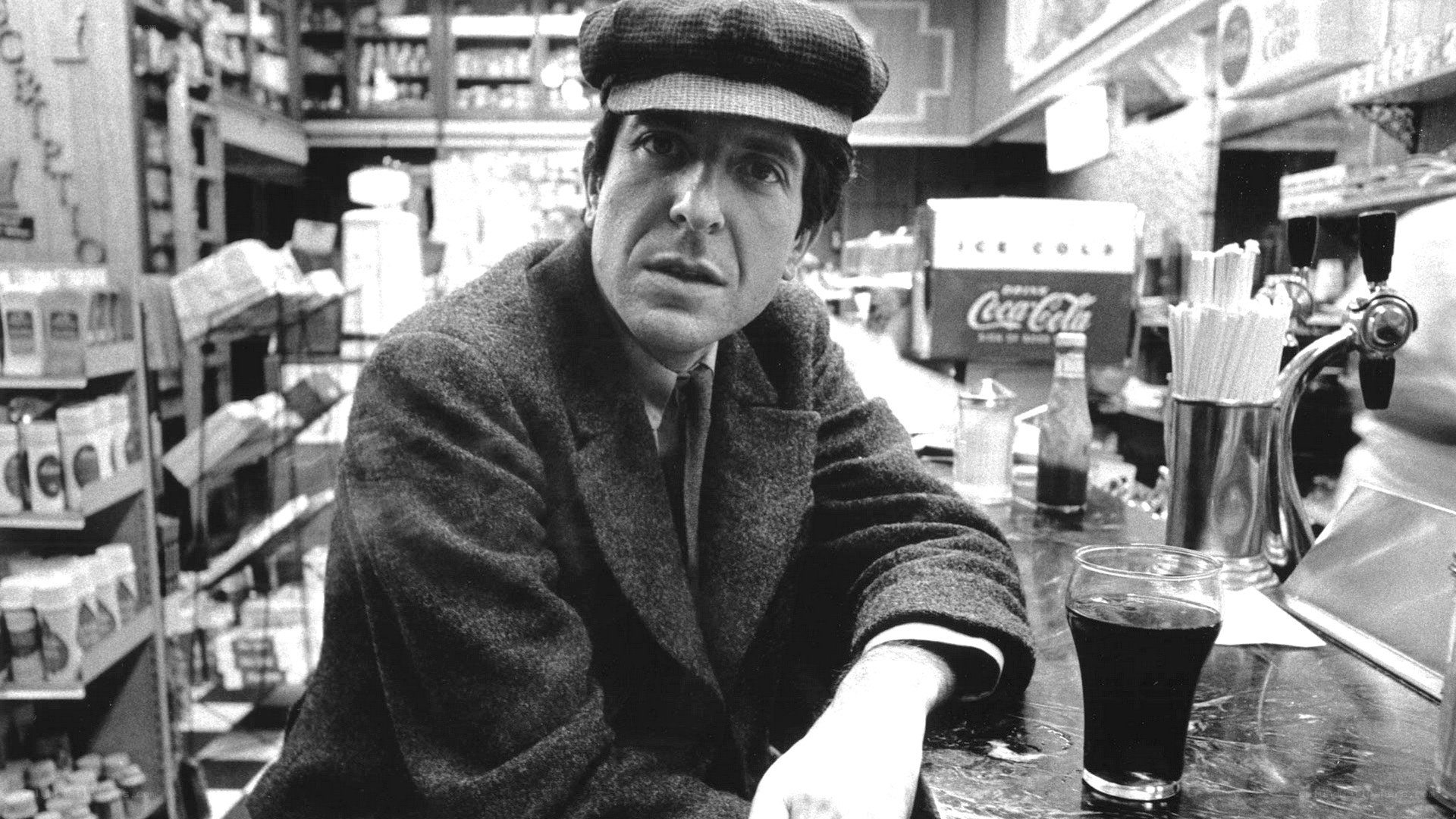 man in a hat at a bar