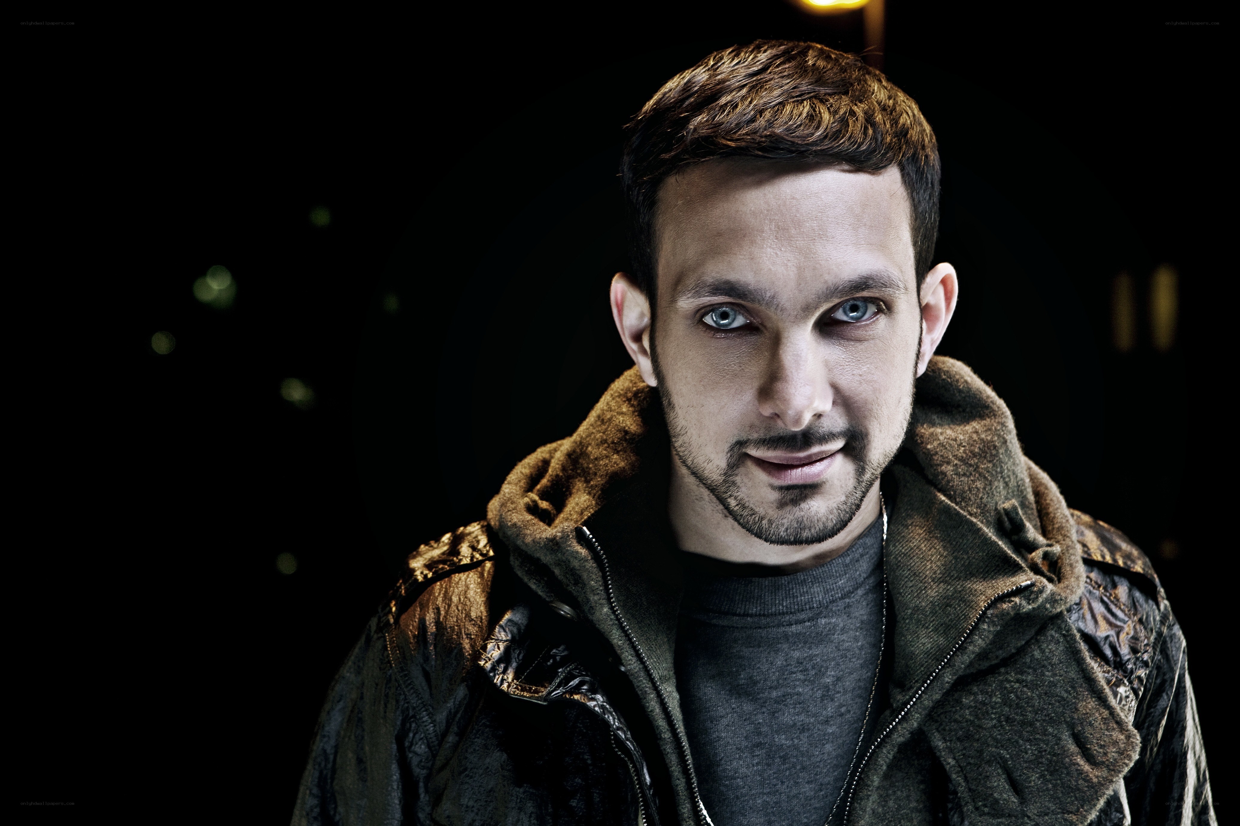 man in a jacket with blue eyes