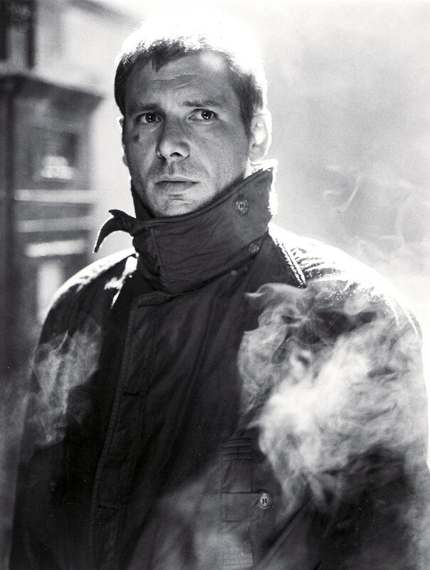man in a jacket with smoke
