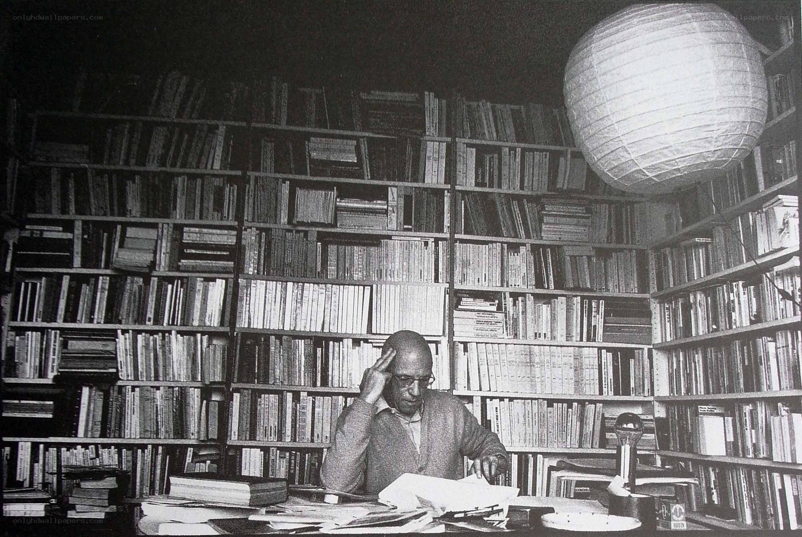 Man in a library with books