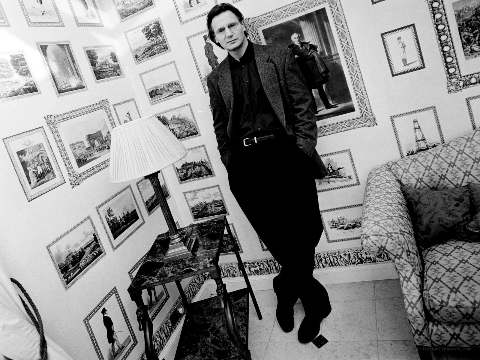 Man in a photo-filled room