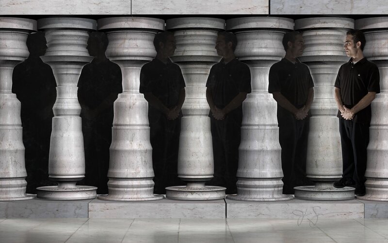 Man in a row of pillars