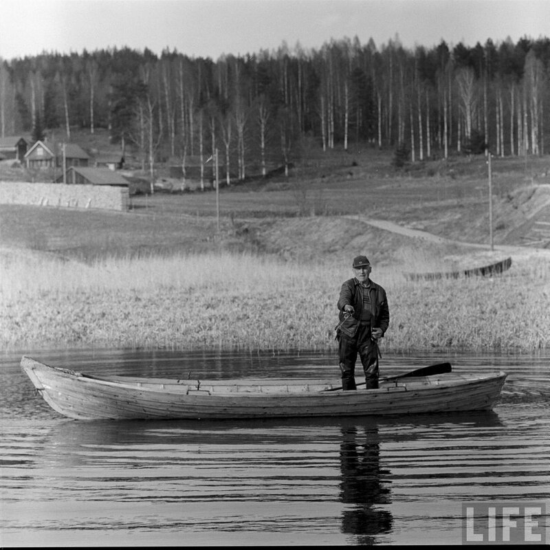 Man in a rowboat on a lake