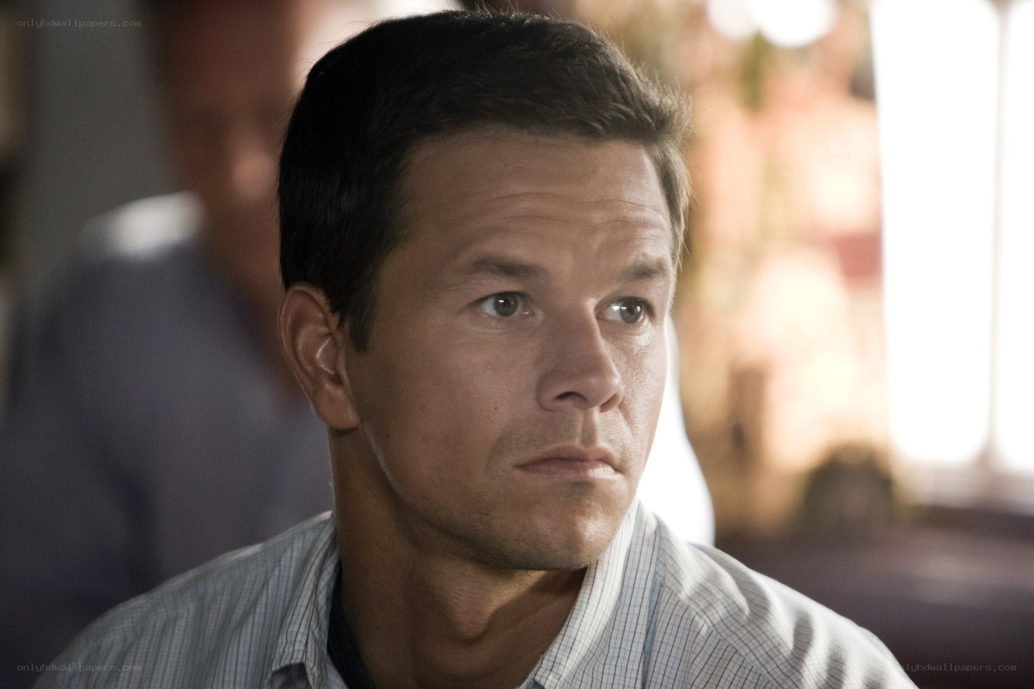 man in a striped shirt