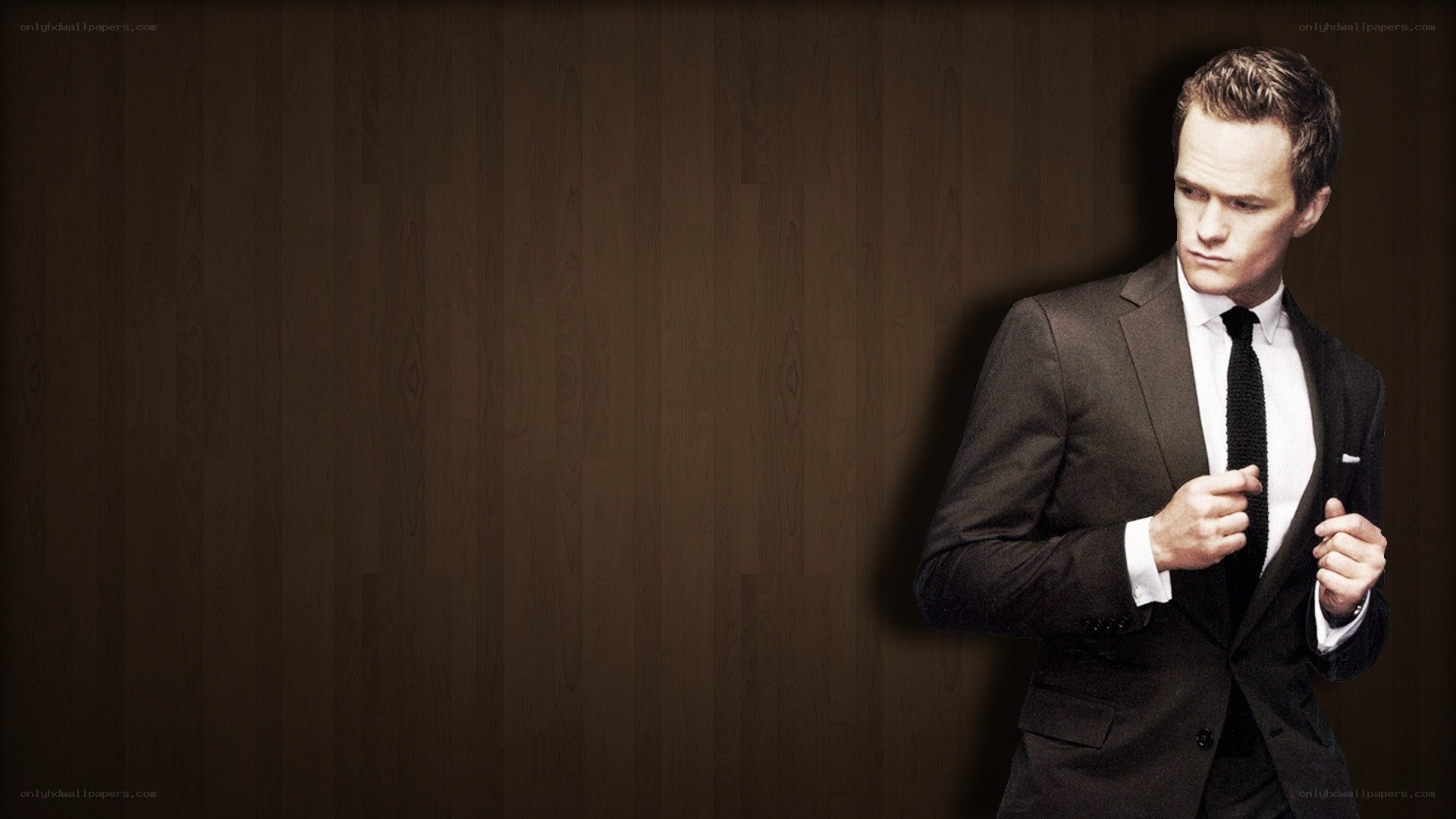 man in a suit adjusting his jacket