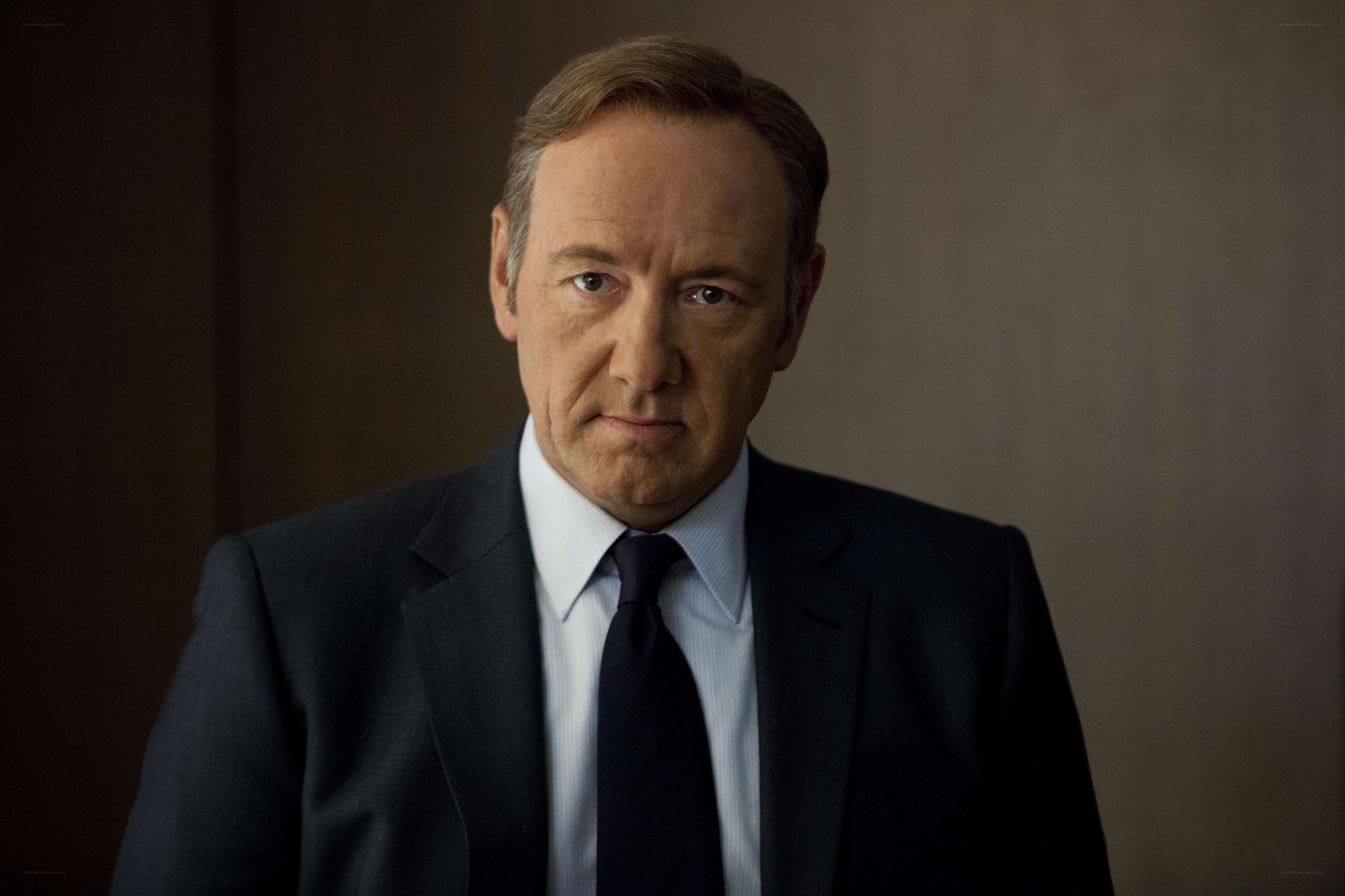 man in a suit looking serious