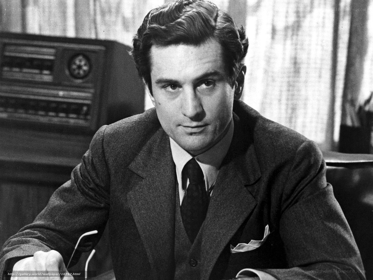 Man in a suit sitting at a desk
