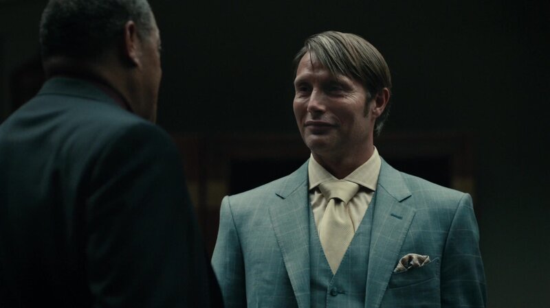 man in a suit talking