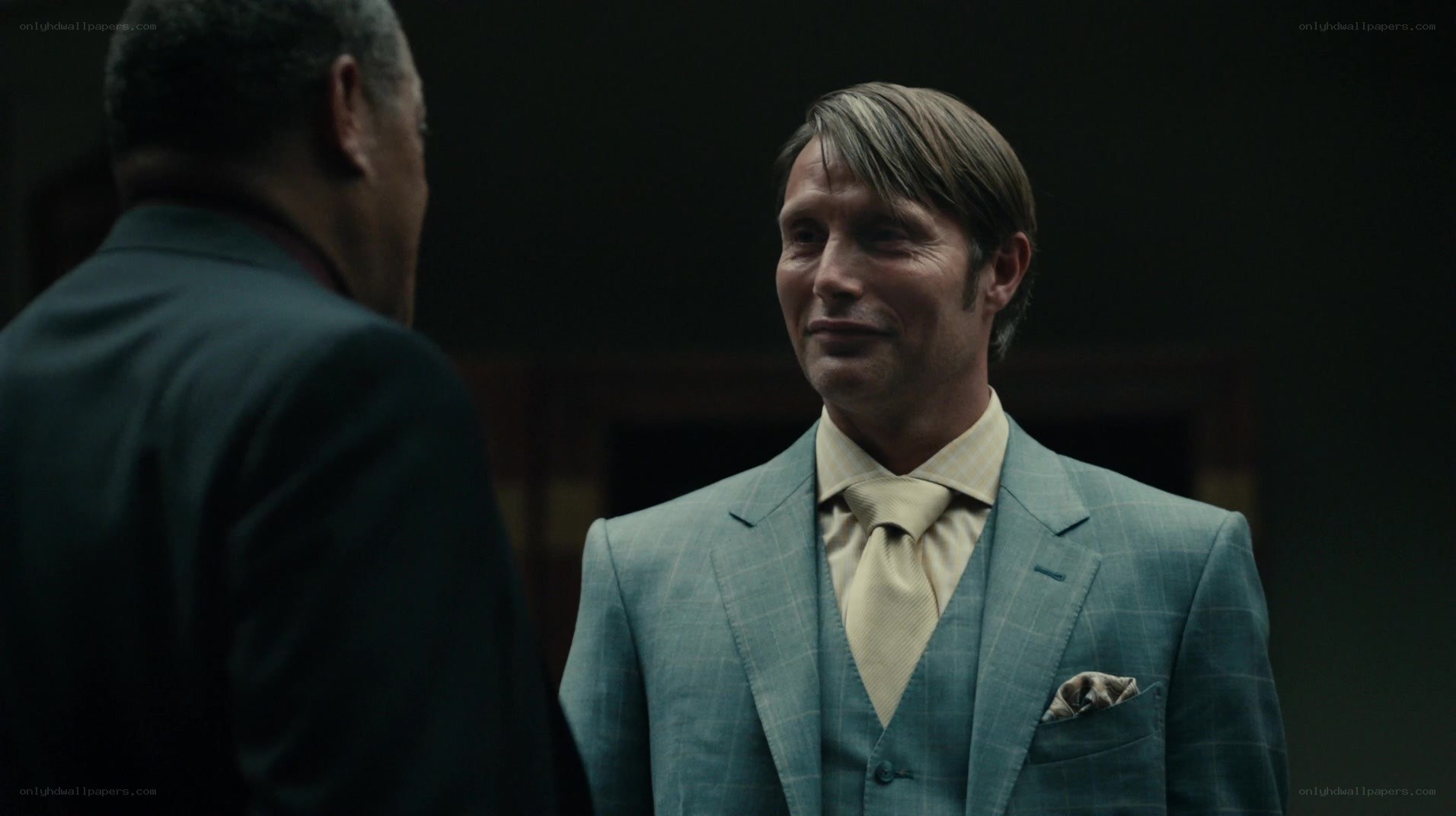 man in a suit talking