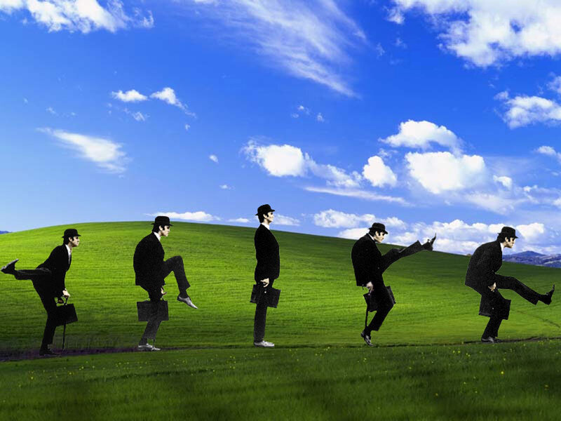 Man in a suit walking across a field