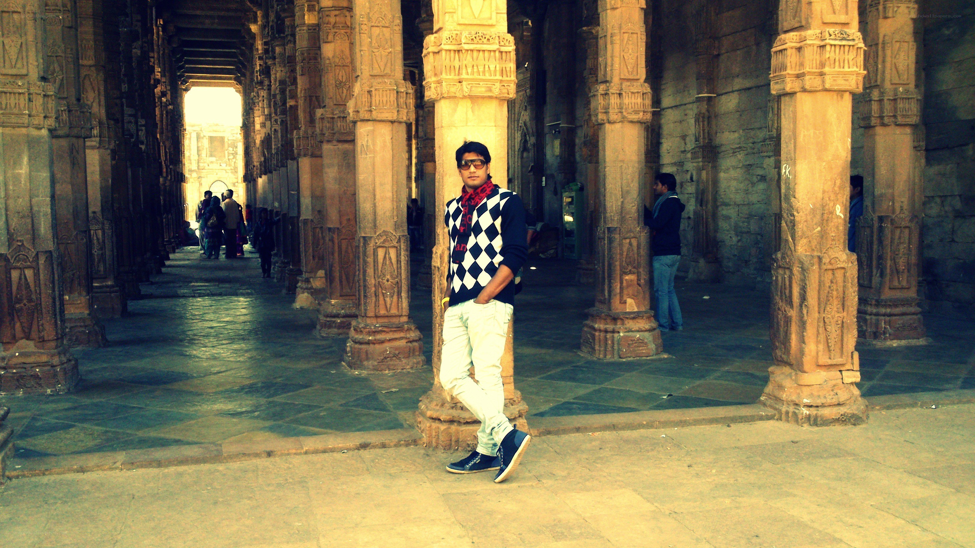 Man in a temple corridor